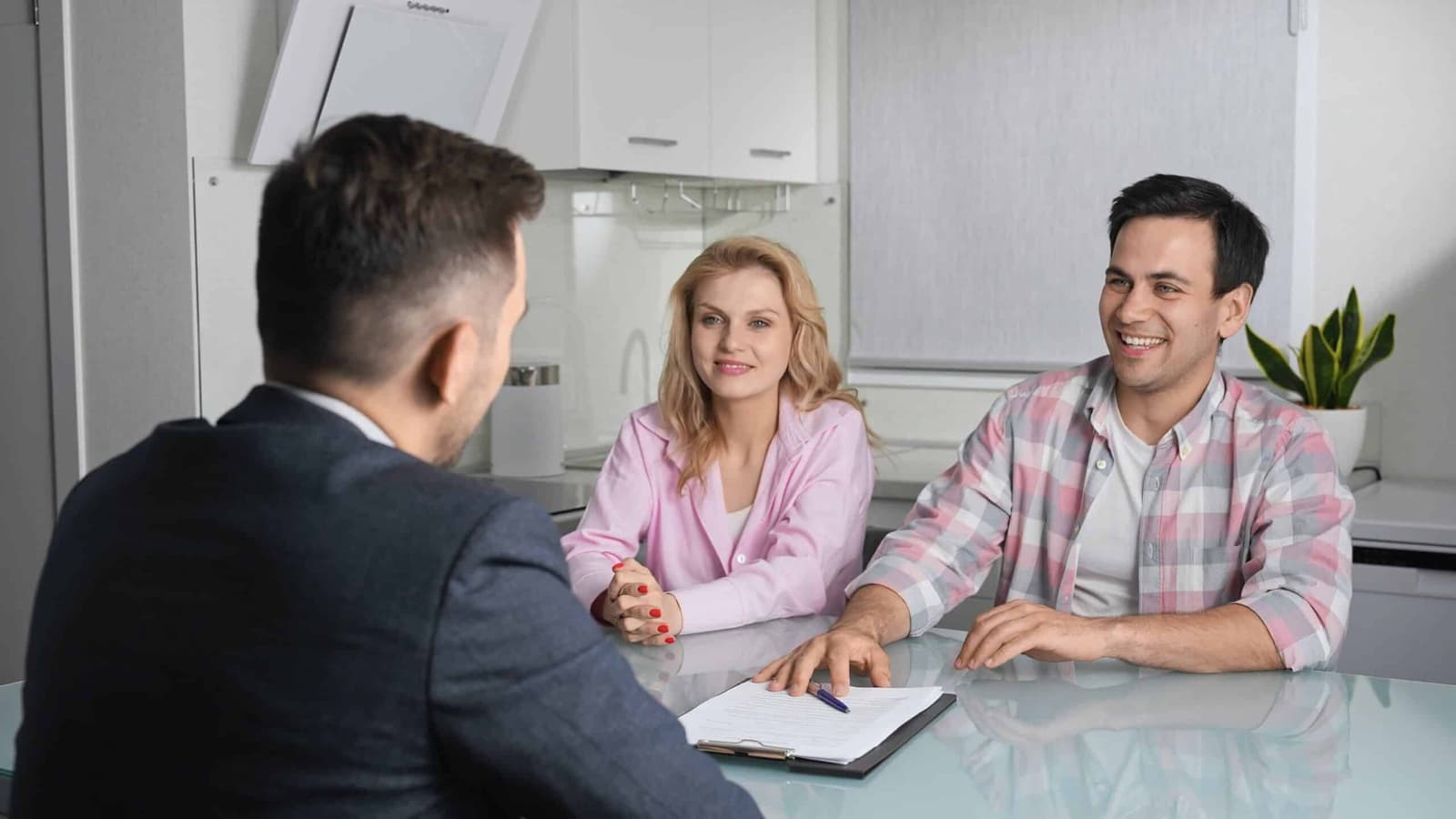 Couple meeting an adviser across a table